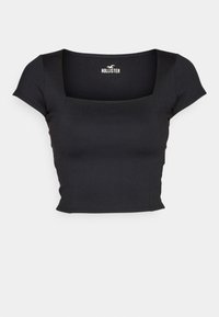 Černý přiléhavý crop top s krátkými rukávy a čtvercovým výstřihem, s malým logem Hollister uvnitř límce.