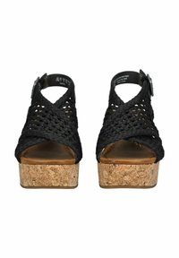 Schwarze geflochtene Kork-Plateau-Sandalen mit offener Zehenpartie und überkreuzten Riemen. Ausgestattet mit einem Kork-Absatz und einem verstellbaren Knöchelriemen.