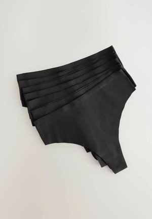 Svarta trosor i mjukt, stretcht tyg, med en högskuren design. Välordnade med släta kanter och inga synliga sömmar.