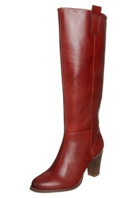 Bottes en cuir rouge montant jusqu'aux genoux, finition lisse, bout carré et talon empilé. Dotées d'une languette de tirage à l'arrière et de détails de couture latérale.