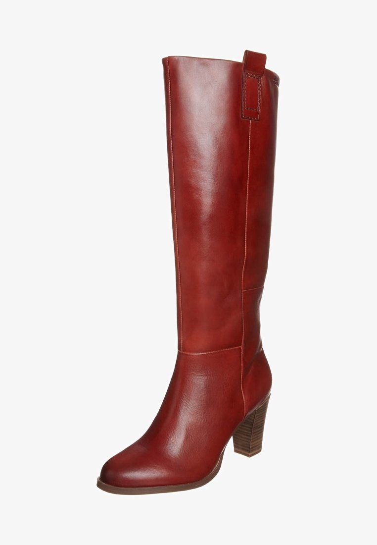 Bottes en cuir rouge montant jusqu'aux genoux, finition lisse, bout carré et talon empilé. Dotées d'une languette de tirage à l'arrière et de détails de couture latérale.