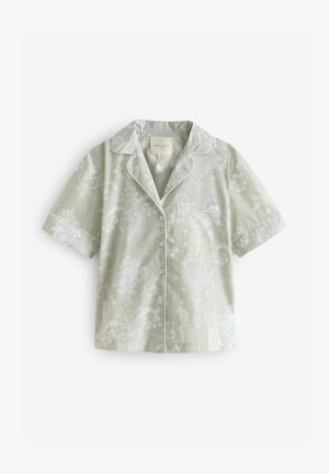 Majica za pižamo kratkih rukava iz svetlo zelene tkanine s cvetnim uzorkom, belim obrubom i džepom na grudima, sa dugmadima sprijeda.