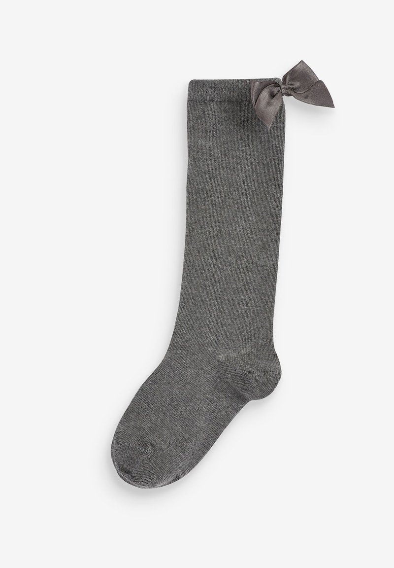 Graue knielange Socke aus weichem Stoff, mit einer glatten Textur und einer dekorativen grauen Schleife oben.