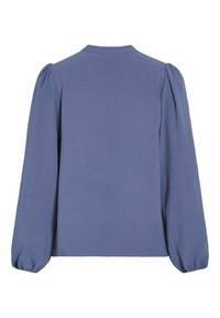 Maglia a maniche lunghe in morbido tessuto blu, con scollo tondo e spalle a soffietto. Texture liscia con polsini arricciati.