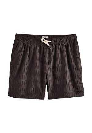 Chiloți de baie negri, texturați, cu talie elastică și șnur alb legat în nod în fața, în centru.