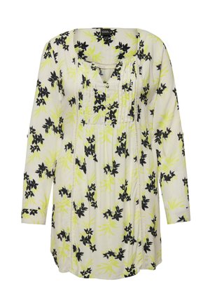 Květinová tunika s černým a žlutým květinovým vzorem na smetanovém pozadí, s výstřihem do V, dlouhými rukávy a detaily na knoflíkovém zapínání.