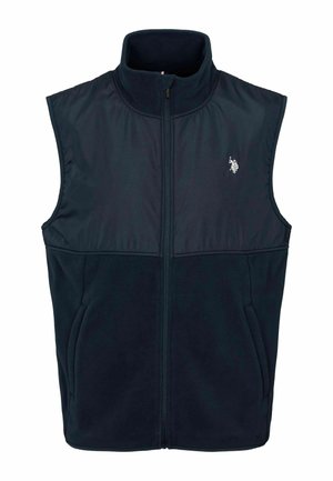 Granatowa, bezrękawnik z polarowym materiałem, z wysokim kołnierzem, zamkiem błyskawicznym z przodu i małym haftowanym logo po lewej stronie klatki piersiowej. Miękka, teksturowana tkanina.