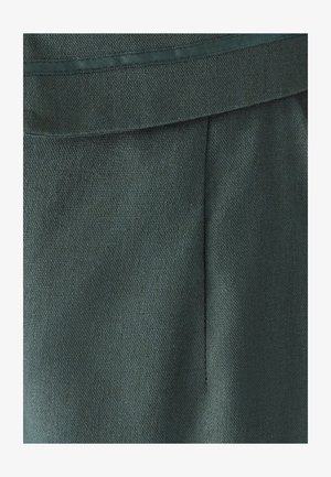 Dark green fabric with a textured finish, featuring a smooth waistband and a subtle pleat detail for a tailored look.