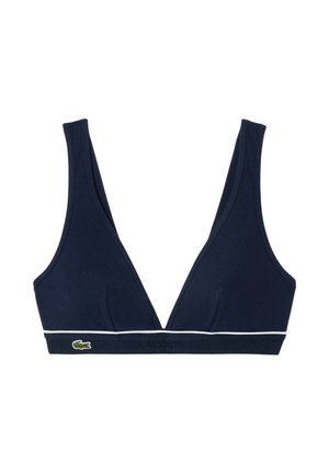 Top bikini triangolare blu navy con spalline larghe, bordo bianco lungo il fondo e piccolo logo verde del coccodrillo sulla fascia.