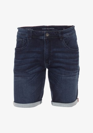 Dunkelblaue Denim-Shorts mit einem verblassten Design, fünf Taschen, einem Knopfverschluss und umgeschlagenen Säumen. Etikett im Taillenbund sichtbar.