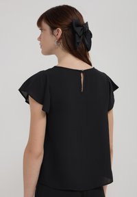 Calliope CON VOLANT - Camicetta - noir
