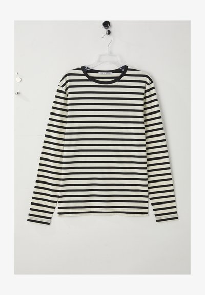 Camisa de mangas longas com riscas horizontais pretas e brancas, decote redondo, feita de um tecido macio, com corte reto e fendas laterais na bainha.