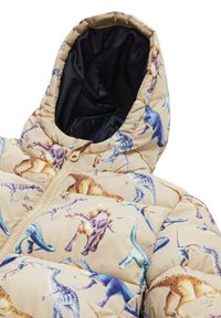 Puffjacke aus beigem Stoff mit buntem Dinosaurierdruck. Sie hat einen Reißverschluss und eine gefütterte Kapuze mit glatter Textur.