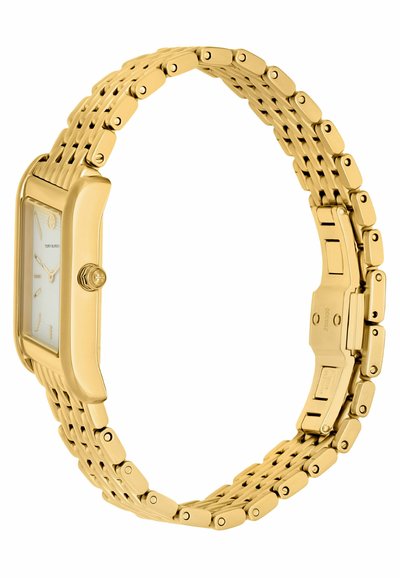 Zlatý kovový hodinky s obdélníkovým ciferníkem, bílým displejem a náramkem ze spojených článků. Obsahují minimální hodinové indexy a kulatou korunku na boku.