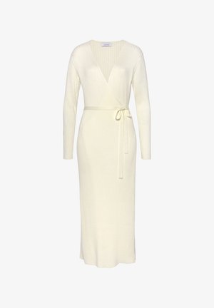 Knit wrap dress in soft cream color, featuring long sleeves, a deep V-neck, a tie belt at the waist, and ribbed texture throughout.