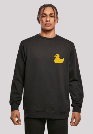 Black sweatshirt made of soft cotton. Features a yellow rubber duck graphic on the left chest area. Classic crew neck and long sleeves.