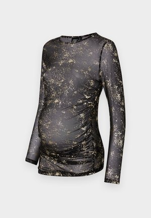 Melnas garām piedurknēm topiņš ar zelta punktiņu rakstu, izgatavots no elastīga auduma, ar rušējumu sānos, lai pielāgotos augošai vēderi.