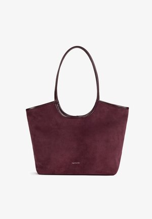 Grand sac cabas en daim bordeaux foncé avec fines poignées et petit logo "nat & nin" au centre à l'avant.
