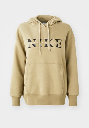 Beige hoodie i bomullsblandning, med en känguruficka, ribbade muddar och en stor svart "NIKE"-logotyp med vita detaljer.