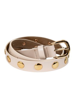 Beež nahkvöö, mis on keerdunud ning millel on ühtlaselt jaotatud kuldsed naelad ning kuldne ristküliku kujuline pannal.