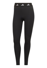 Svarta leggings i stretchmaterial, med en bred midja med en vit logotyp, slät yta och en kroppsnära silhuett.
