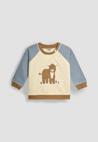 Felpa leggera color crema con maniche raglan blu, dettagli marroni e design di una mucca marrone ricamato. Presenta una chiusura a scatto al collo.