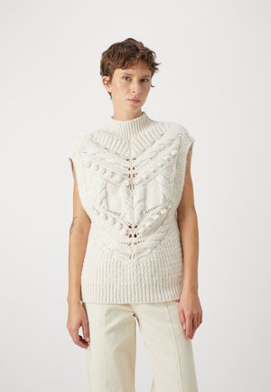 Knit sleeveless top made from white yarn, featuring cable patterns, a high collar, and textured detailing throughout.