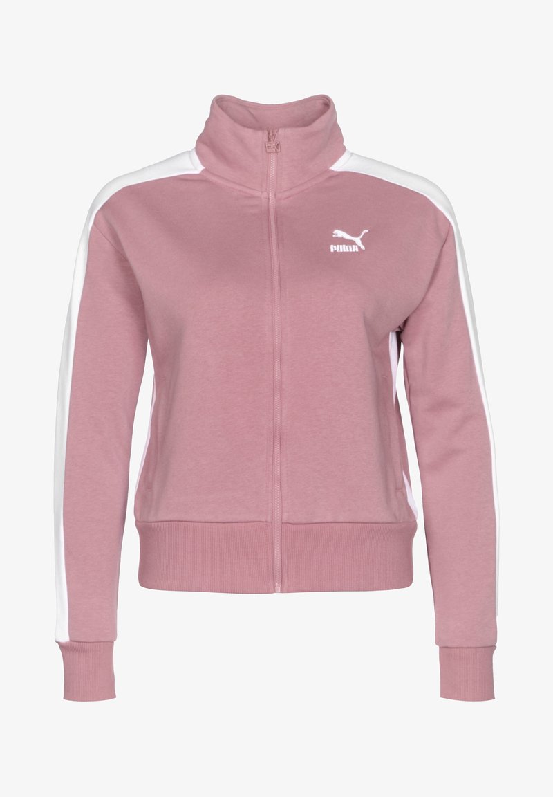 Puma Zip-Jacke in zartem Pink mit weißen Seitenstreifen. Sie verfügt über einen hohen Kragen, lange Ärmel und gerippte Bündchen für eine figurbetonte Passform.