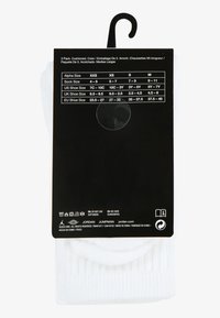 White crew socks in a pack of three, cushioned design with ribbed texture. Black packaging includes size and care information.