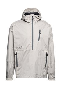 Hellbeige wasserdichte Jacke mit hohem Kragen, Kordelzugkapuze und zwei Reißverschlusstaschen. Verfügt über elastische Bündchen und ein Logo auf der Vorderseite.