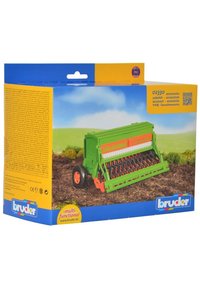 Green toy seed drill with orange accents, featuring wheels, a textured seedbed, and detailed mechanisms. Packaging includes multi-language information.