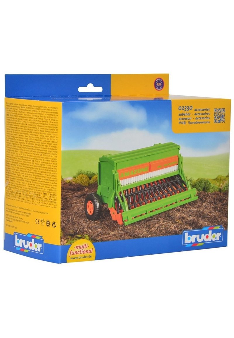 Green toy seed drill with orange accents, featuring wheels, a textured seedbed, and detailed mechanisms. Packaging includes multi-language information.