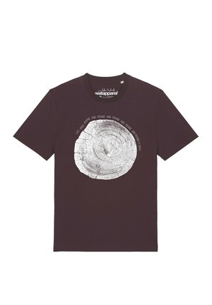 Dark brown t-shirt with a white tree ring graphic and the text "Life goes round and round and round and round it goes" around the circle.