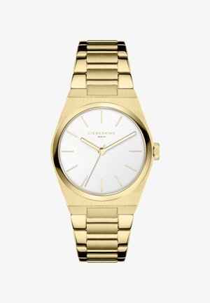 Guld metalur med en rund hvid urskive, minimalistiske time markører og et poleret lenkearmbånd. Glat, moderne design med en mat finish.