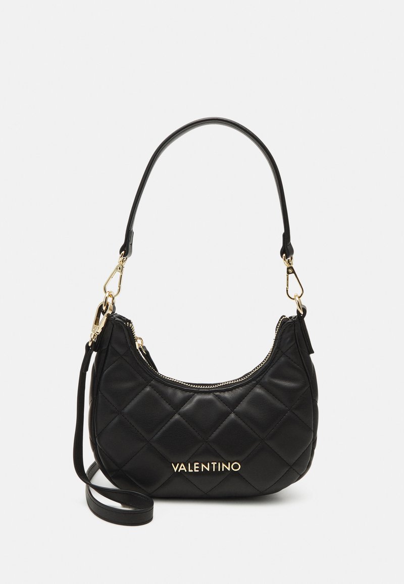 Black leather handbag with a quilted design, gold hardware, and the word "Valentino" embossed in gold. Features a short handle and removable strap.