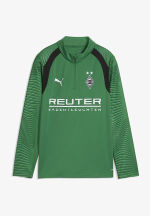 Zielona sportowa koszulka z długim rękawem z czarnymi akcentami na ramionach, logo Puma, herb Borussia Mönchengladbach i tekst sponsorski Reuter z przodu.