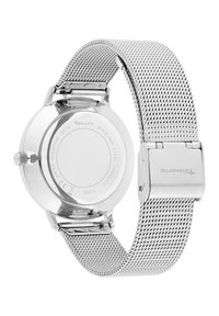 Silberner Edelstahl-Uhren mit einem Mesh-Armband, runder Gehäuse, wasserfest bis 3 ATM und einem sicheren Verschluss. Logo sichtbar am Armband.