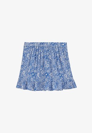 Jupe à motifs bleus et blancs avec des dessins floraux hexagonaux et des cœurs, et un ourlet à volants sur fond blanc.