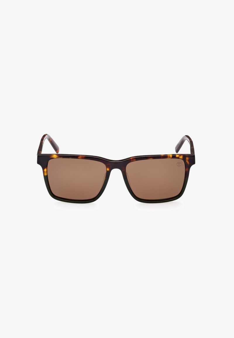 Ochelari de soare tortoise brown cu rame pătrate și lentile maronii. Se remarcă printr-un design elegant și o textură de suprafață netedă.