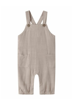 Béžové detské nohavice na traky s nastaviteľnými ramennými trakmi, dvoma prednými vreckami, zapínaním na gombíky a elastickými otvoreniami na nohaviciach.
