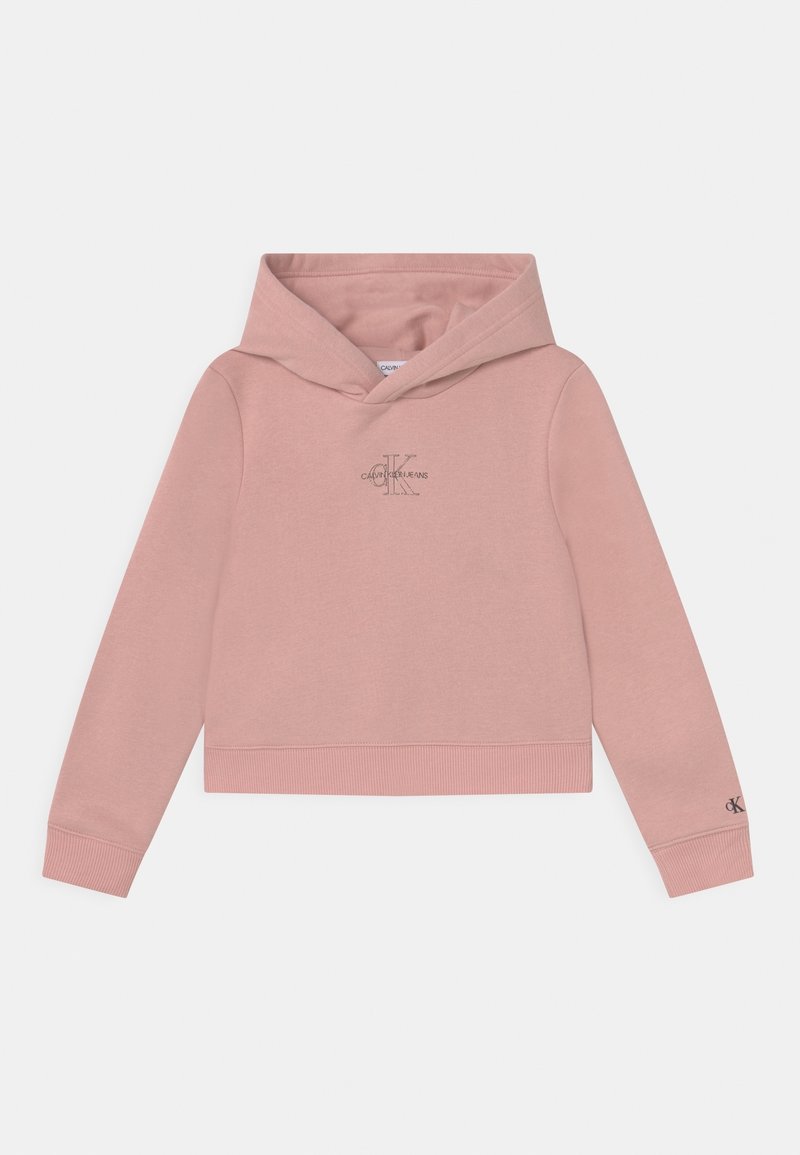 Rosa huvtröja i mjukt tyg, med en logga på bröstet och ribbade muddar och nederkant. Enkel design, croppad passform.