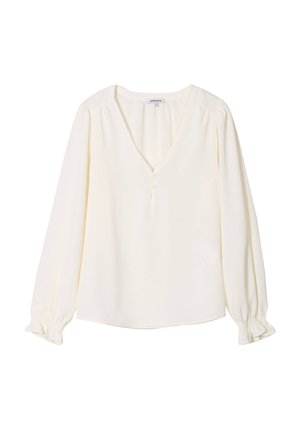 Blusa a maniche lunghe di colore crema con scollatura a V, dettagli con bottoni e polsini arricciati. Tessuto morbido con un lieve caduta e vestibilità rilassata.