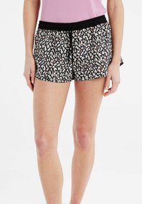 Pantaloni corte neri floreali con vita elasticizzata e coulisse, caratterizzati da piccoli motivi floreali rosa e bianchi, realizzati in tessuto leggero e con una vestibilità rilassata.