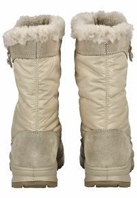 Béžové zateplené zimní boty s huňatým, světlým lemem. Vyrobené z polstrované tkaniny a semiše, s texturovanou gumovou podrážkou.
