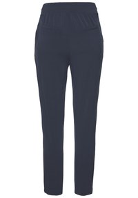 Marineblaue Jogginghosen aus weichem Stoff, mit einem elastischen Bund und zwei Gesäßtaschen, im tapered Schnitt.