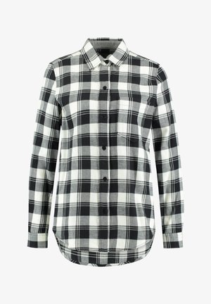 Chemise à carreaux noir et blanc à manches longues, boutonnée, avec col et une poche poitrine sur fond blanc.