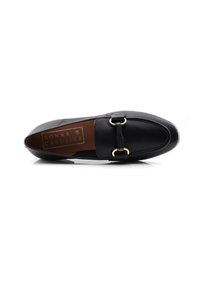 Black loafers made of textured leather, featuring a gold-tone buckle accent and a slightly pointed toe. The insole has branding detail.