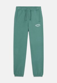 Gröna sweatpants i mjukt tyg, med elastisk midja, två sidofickor och vit broderad text på vänster lår.