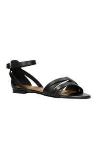 Czarne skórzane sandały z wieloma cienkimi paskami wzdłuż palców i kostki, z płaską podeszwą i minimalistycznym designem dla komfortu.