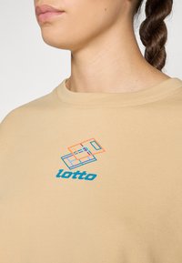 Beige sweatshirt with a round neck, featuring a colorful Lotto logo and geometric design in orange, blue, and green on the front.